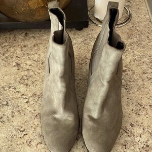 Booties Boots Color is Gray have a big Black heel on the bottom.